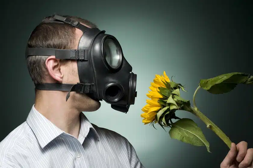 Guy using a mask to stop his hay-fever Willow Chiropractic