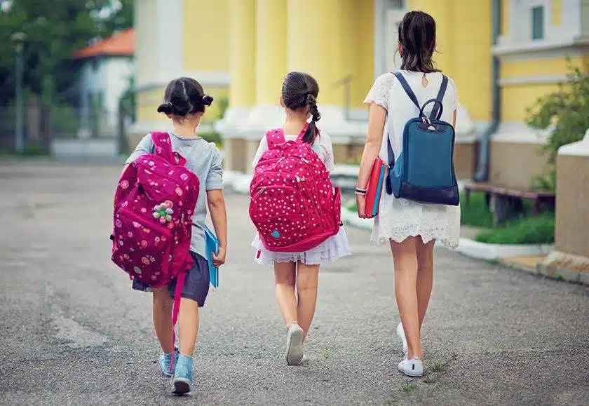 three children walking to school Willow Chiropractic