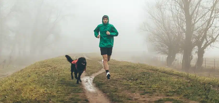 Guy running with his dog Willow Chiropractic